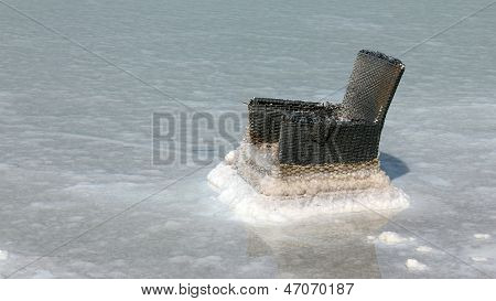 Dead Sea. Wicker Chair Gradually Becomes Covered With Salt