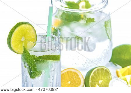 A Glass And A Jug Looks Very Attractive With Lemon