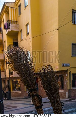 View Of Old Straw Brooms Used For Cleaning In The City Of Ronda, Spain