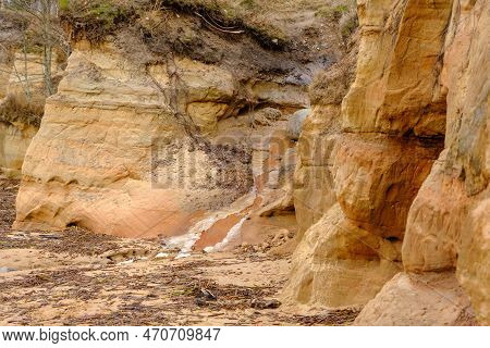 Beautiful In Any Weather, Colorful Sandstone Cliffs. Beautiful Coast Of The Baltic Sea With Caves. V