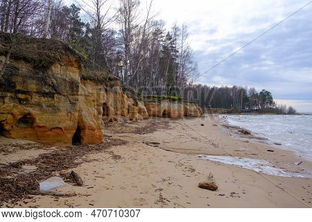 Beautiful In Any Weather, Colorful Sandstone Cliffs. Beautiful Coast Of The Baltic Sea With Caves. V