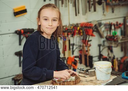 Artisan Boy Is Putting A Protective Mordant On The Wood. Cute Boy Makes Wooden Clock In The Workshop