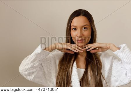 Young Multiracial Woman Doing Face Building Yoga And Facial Gymnastics Self Massage And Rejuvenating