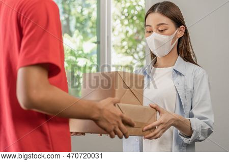 Asian Young Woman, Client Received A Delivery Of Cardboard Box, Parcel From Delivery, Postman, Weari
