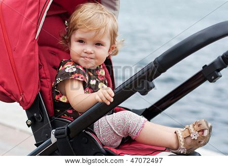 Happy Baby In A Stroller