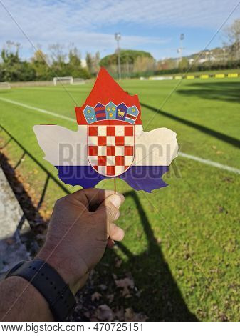 Hand Holding A Tree Leaf With The Flag Of Croatia