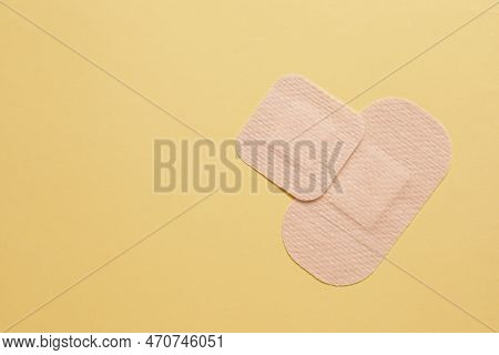 Different Contraceptive Patches On Yellow Background, Flat Lay. Space For Text