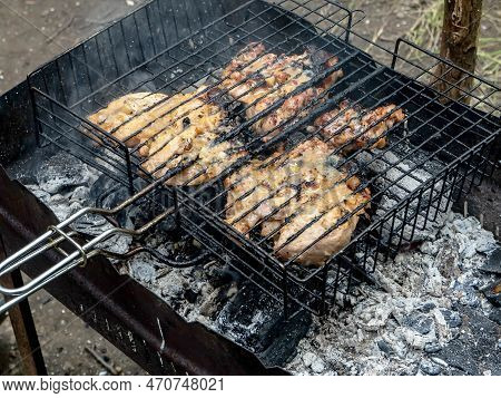 Meat Is Cooked On The Grill On The Grill In The Summer