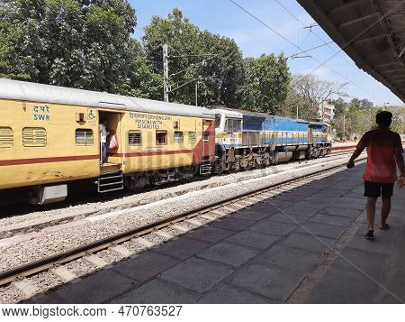 Closeup Of Beautiful Mandya Railway Station And Electric Train Moving On A Track.