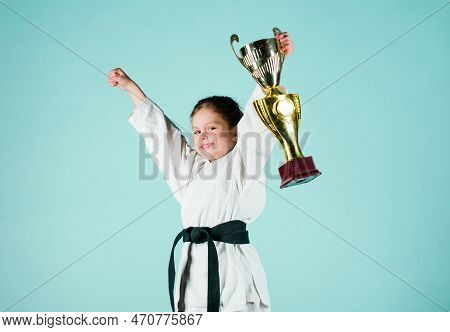 Sport Success. Training To Be The Best. Small Girl With Champion Cup. Martial Arts. Practicing Kung 