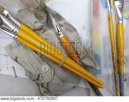 Painter Brushes Over Table