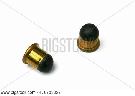 Close-up On Two .22 Bb Cap, A Variety Of .22 Caliber (5.6 Mm) Rimfire Ammunition.