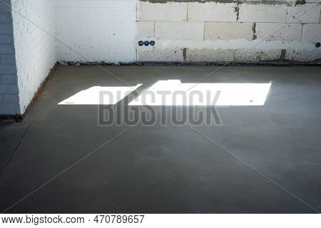 The Leveled Rough Floor In A House Under Construction With A Semi-dry Cement Screed Is A Smooth Surf