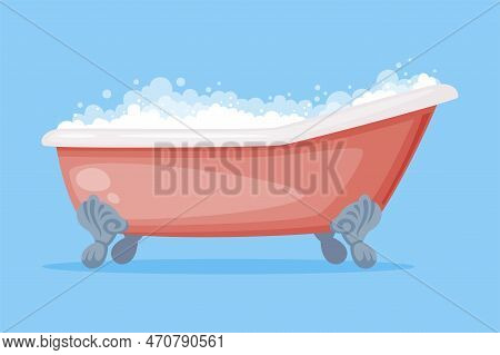 Cast Iron Bathtub On Claw Foot Pedestal Full Of Water With Soap Bubbles Foam Isolated On Blue Backgr
