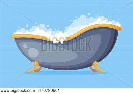 Cast Iron Bathtub On Claw Foot Pedestal Full Of Water With Soap Bubbles Foam Isolated On Blue Backgr
