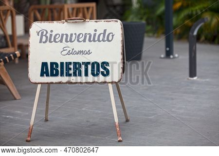 Outdoor Open Sign With Written In It In Spanish 