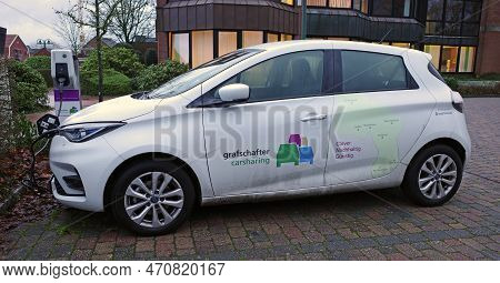 Emlichheim, Germany Jan 11 2023 - All Electric Car Sharing Car Connected To A Charging Station. It's