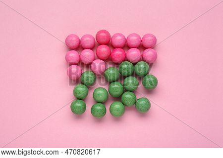 Many Bright Chewy Gumballs On Pink Background, Flat Lay
