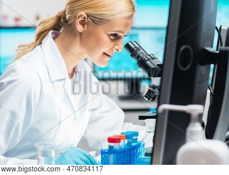Professional Female Scientist Is Working On A Vaccine In A Modern Scientific Research Laboratory. La