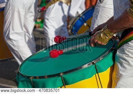 Close-up On A Percussionist Playing With A Drum During The Carnival Of The Grand Boucan.