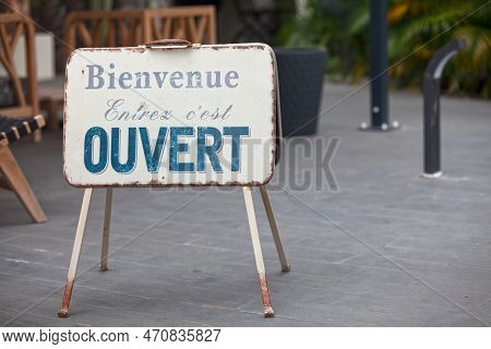 Metallic Outdoor Shop Sign Stating In French 