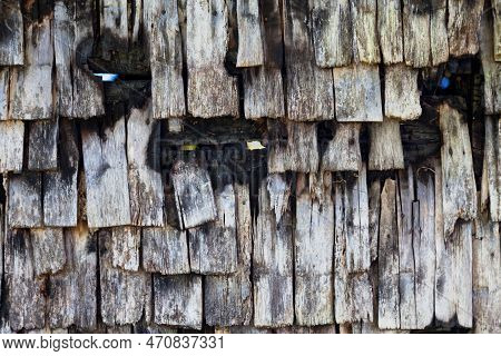 Close-up On A Wooden Tile Wall Of A House Burnt To The Ground By A Pyromaniac.