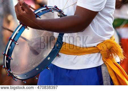 Musician Playing With Frame Drum During The Carnival Of Grand Boucan.