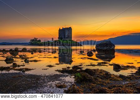 Sunset Over Castle Stalker In Scotland, United Kingdom. Castle Stalker Is A Picturesque Tower House 