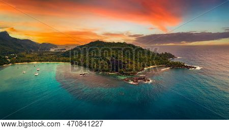 Aerial Sunset View Of Port Launay Beach At The Mahe Island, Seychelles, With Colorful Clouds, Turquo