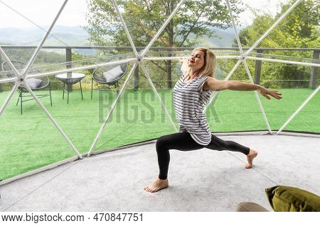 Woman Doing Yoga Glamping House . Healthy Lifestyle Concept. Weekend Getaway At Glamping. Mental Hea