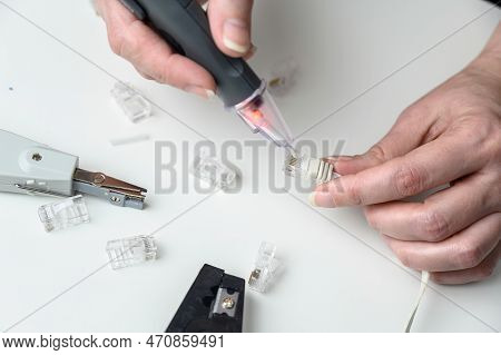 Installation Of Internet Networks. A Communications System Technician Checks The Signal On A Data Li