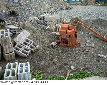 Building Blocks On The Ground. Material For The Construction Of Warm Houses. Progress. Construction 