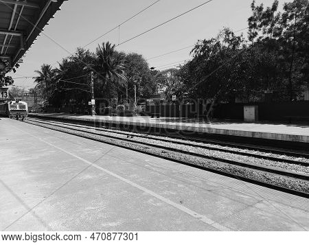 Closeup Of Beautiful Mandya Railway Station And Electric Train Moving On A Track.
