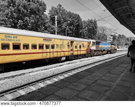 Closeup Of Beautiful Mandya Railway Station And Electric Train Moving On A Track.