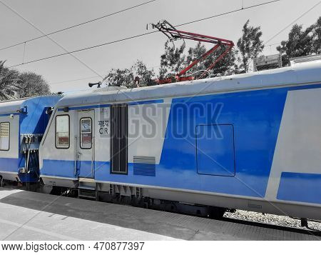 Closeup Of Beautiful Mandya Railway Station And Electric Train Moving On A Track.