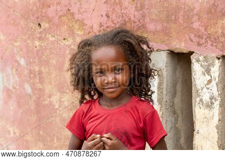 Bekopaka - Antsalova, Madagascar- November 6. 2022: Small Cute Malagasy Girl With Long Hair , Happy 