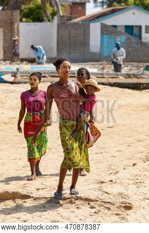 Morondava, Madagascar - November 3. 2022: Malagasy Woman With Her Face Painted Against The Sun And A