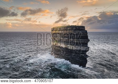 Large Sea Stack Downpatrick Head, With Rock Layers Of Millennia Of Erosion Standing In Atlantic Ocea
