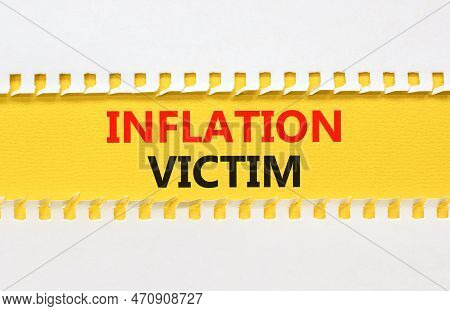 Inflation Victim Symbol. Concept Words Inflation Victim On Yellow Paper. Beautiful Yellow Table Whit