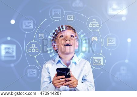Happy Child Boy With Phone In Hand, Looking Up Digital Hologram With Nft Artwork. Digital Content In
