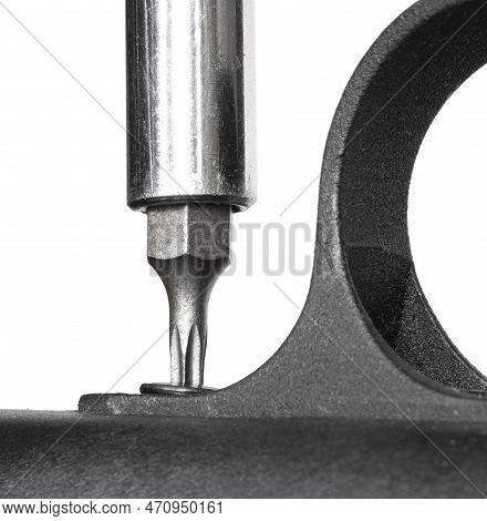 Trigger Guard On A Rifle Being Taken Off With A White Background