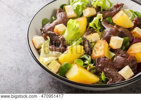 Salad Made With A Combination Of Gizzards, Onions, Potatoes, Shallots, Lettuce, Balsamic Vinegar, Ol