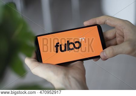 Irpen, Ukraine - January 20 20223, Closeup Of Smartphone Screen Fubo Tv Logo Lettering With In Mans 