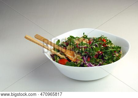A Bowl Of Warm Salad With Orzo Pasta, Arugula, Tomatoes And Salami On A White Table. Copy Space.