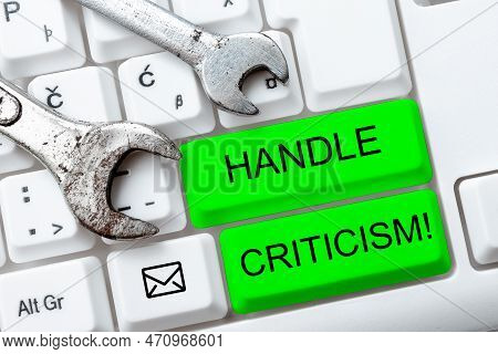 Hand Writing Sign Handle Criticism. Word For Process Of Withstanding Valid And Well Reasoned Opinion