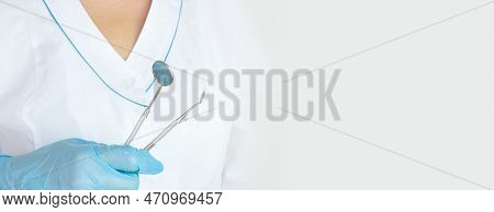Different Tools For Dental Care In Docktor Hand. Dental Background. With Copy Space, Close-up. Oral 