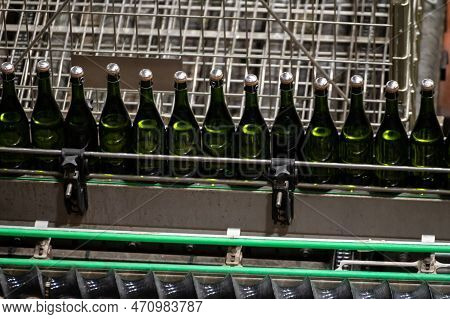 Production Of Cremant Sparkling Wine In Burgundy, France. Automatically Powered Bottling Lines On Fa