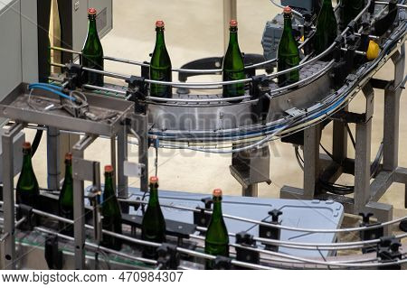 Production Of Cremant Sparkling Wine In Burgundy, France. Automatically Powered Bottling And Corking