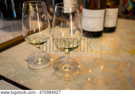 Tasting Of White Dry Chablis Wine In Small Winery In Chablis Town, Burgundy, France