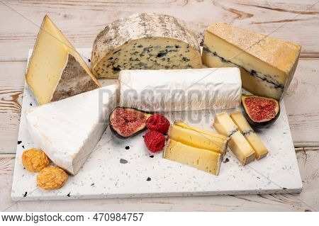 Cheese Collection, Marble Board With French Cheeses Brie, Tomme, Matured Goat Cheese, Morbier  Serve